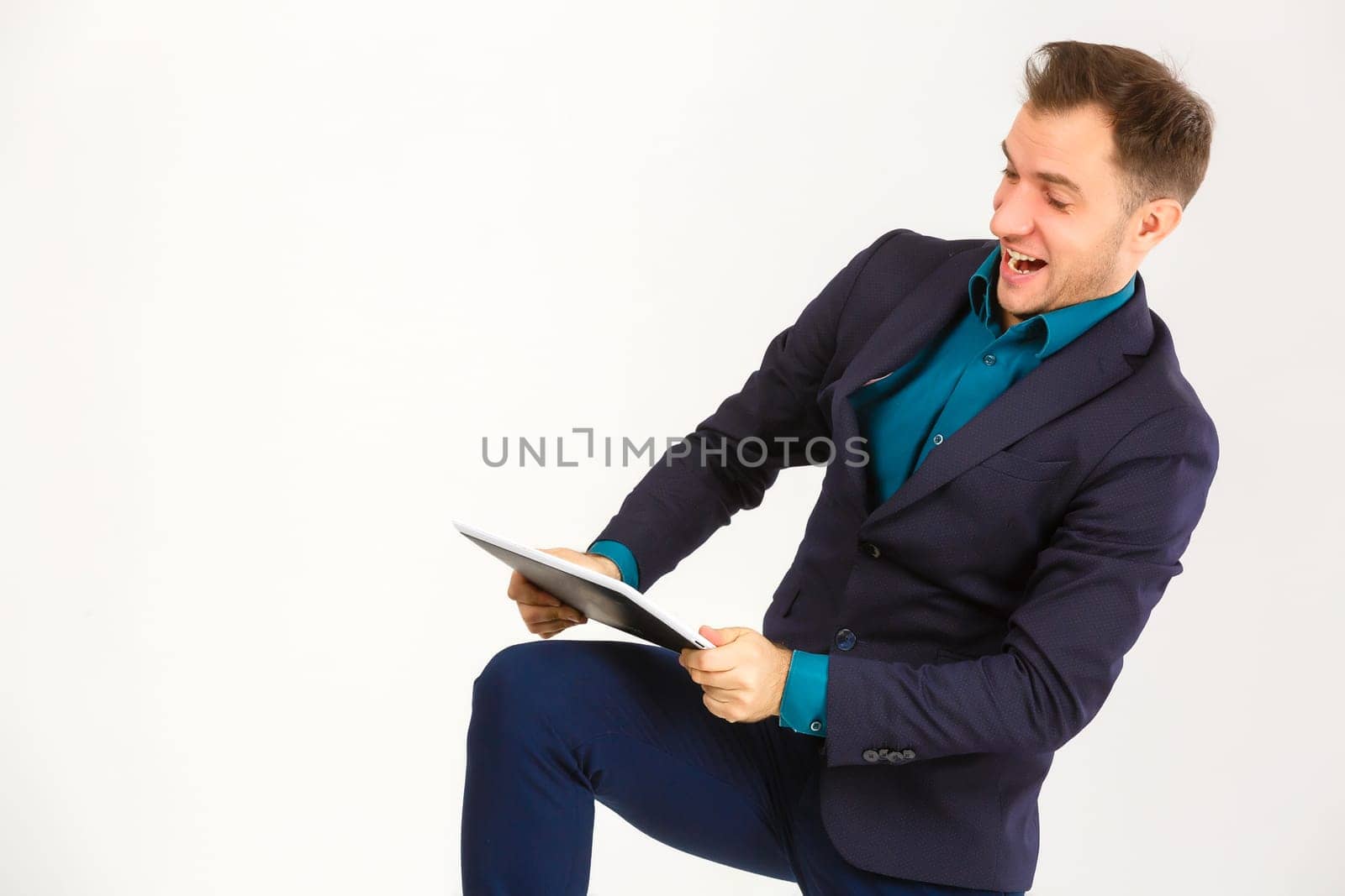 Mad man with digital tablet on white background