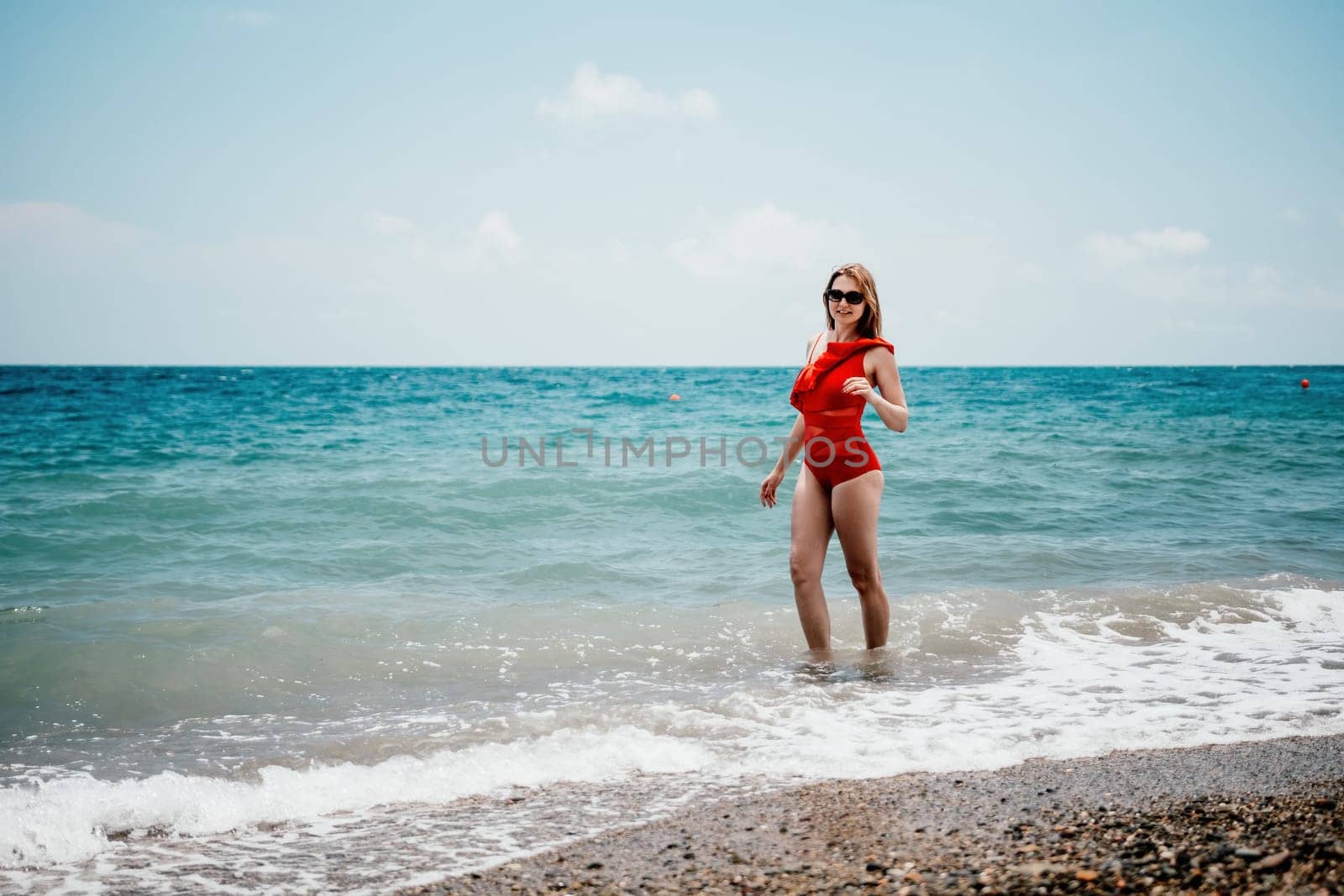 Happy loving family mother and daughter having fun together on the beach. Mum playing with her kid in holiday vacation next to the ocean - Family lifestyle and love concept by panophotograph