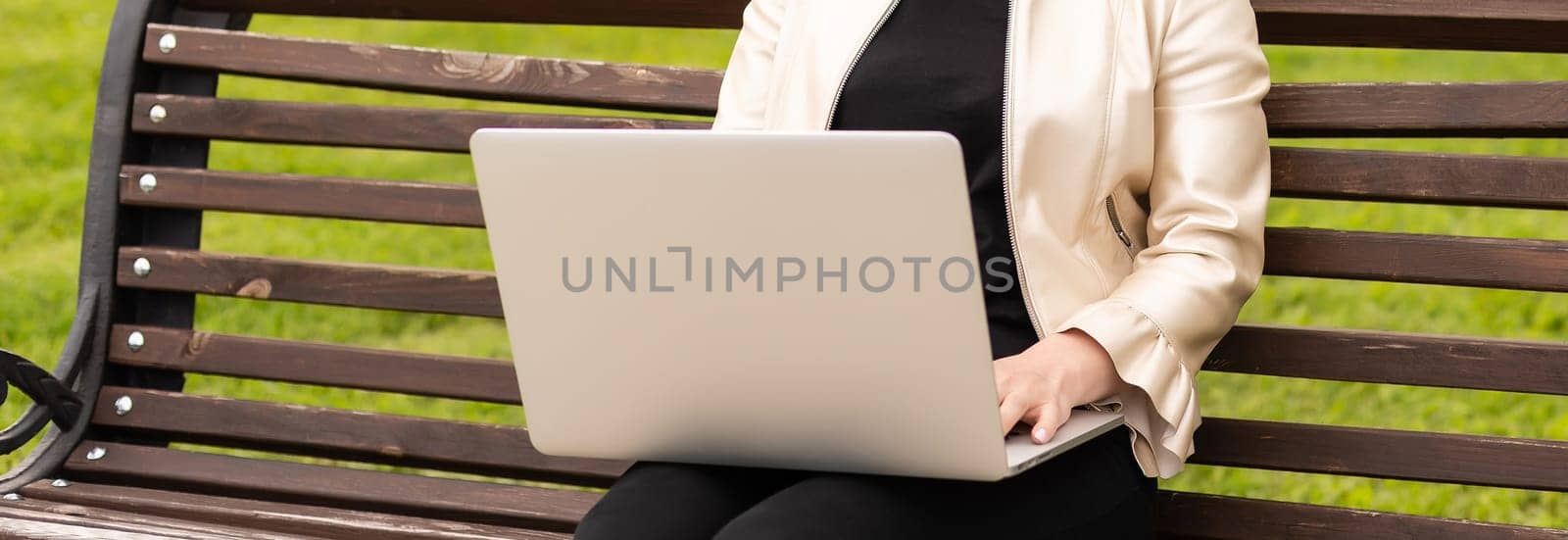 Image of elegant employer sitting on the bench by Andelov13