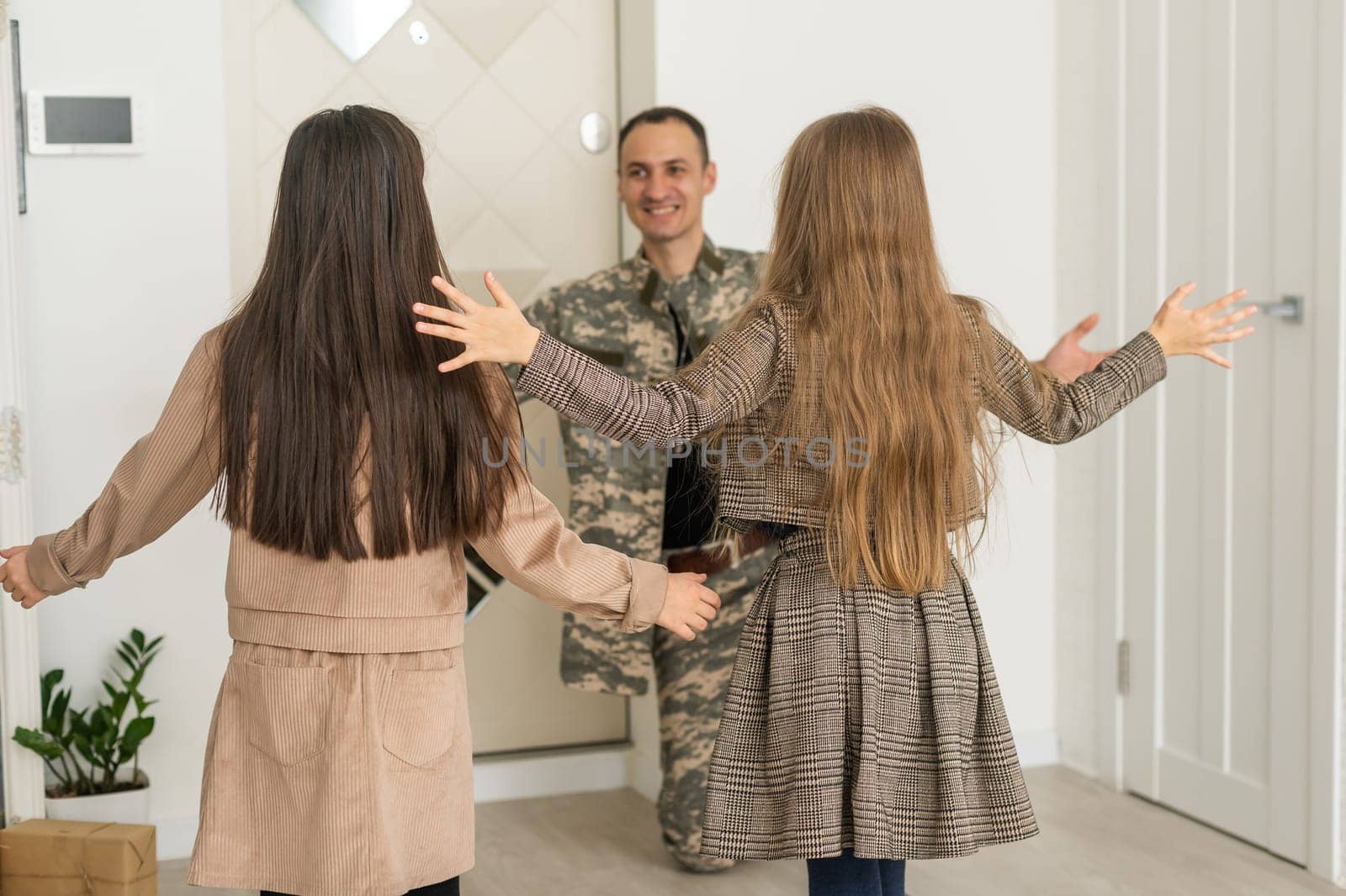 Happy military father holding daughter. family, bonding and patriotism,