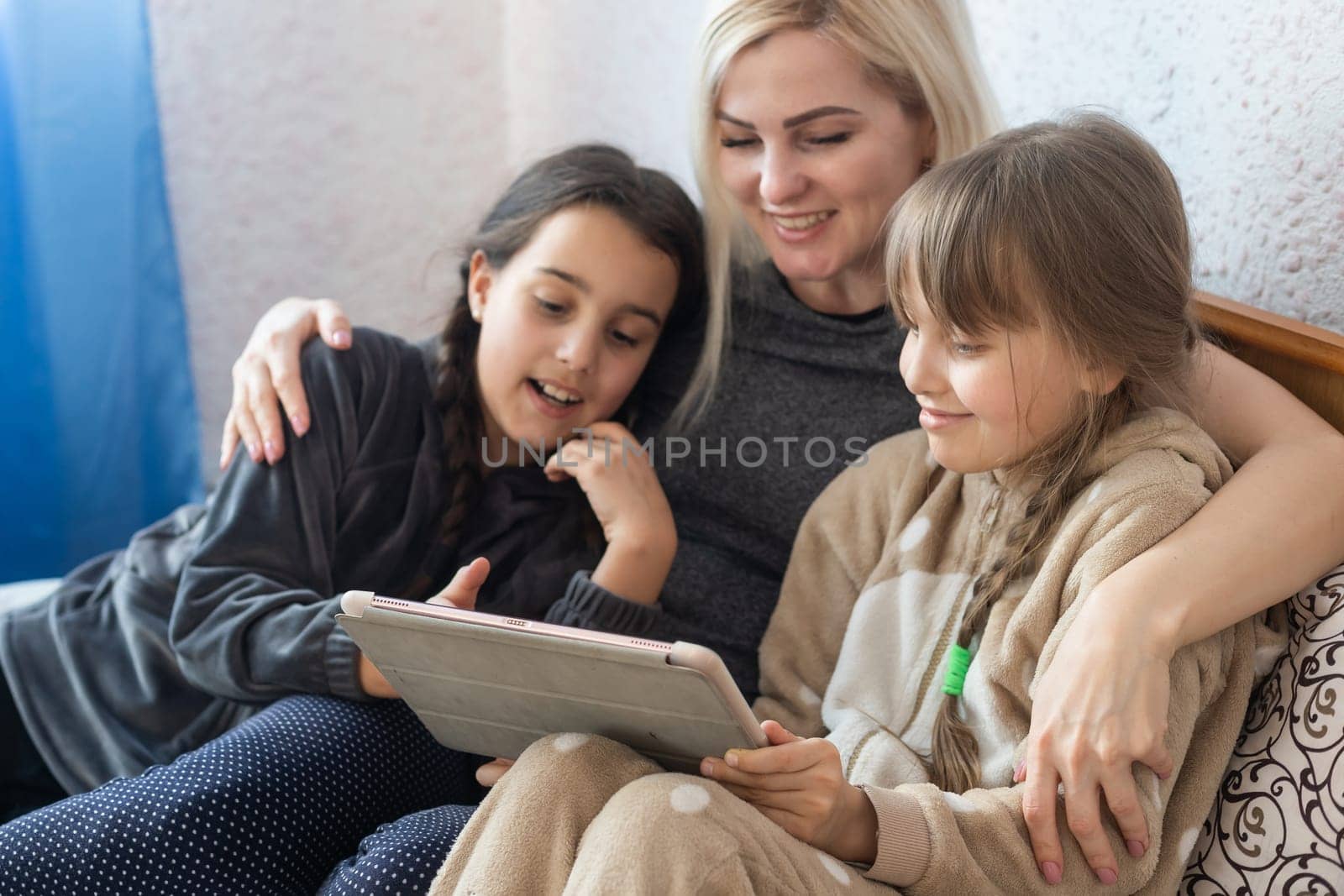 Mother and daughter looking at tablet.