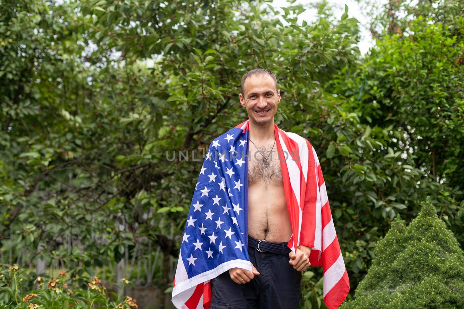 Naked man with american flag. High quality photo