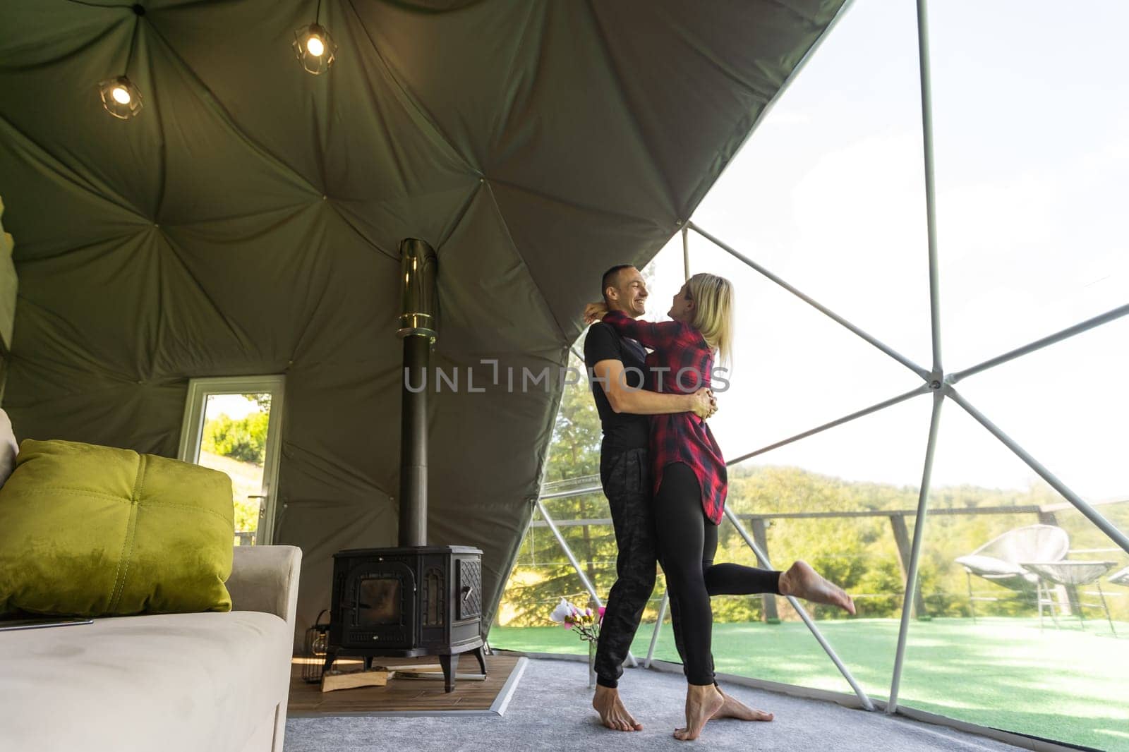 a couple dancing in geo dome tents. by Andelov13