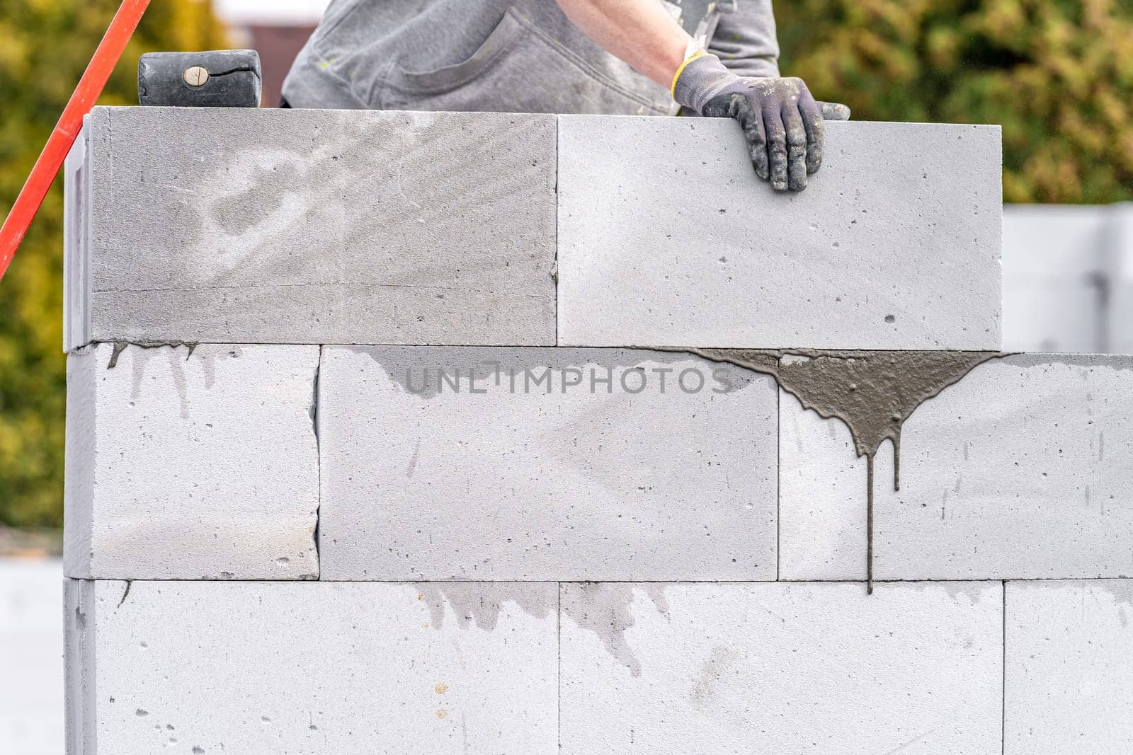 construction of a wall of a house made of aerated concrete blocks.