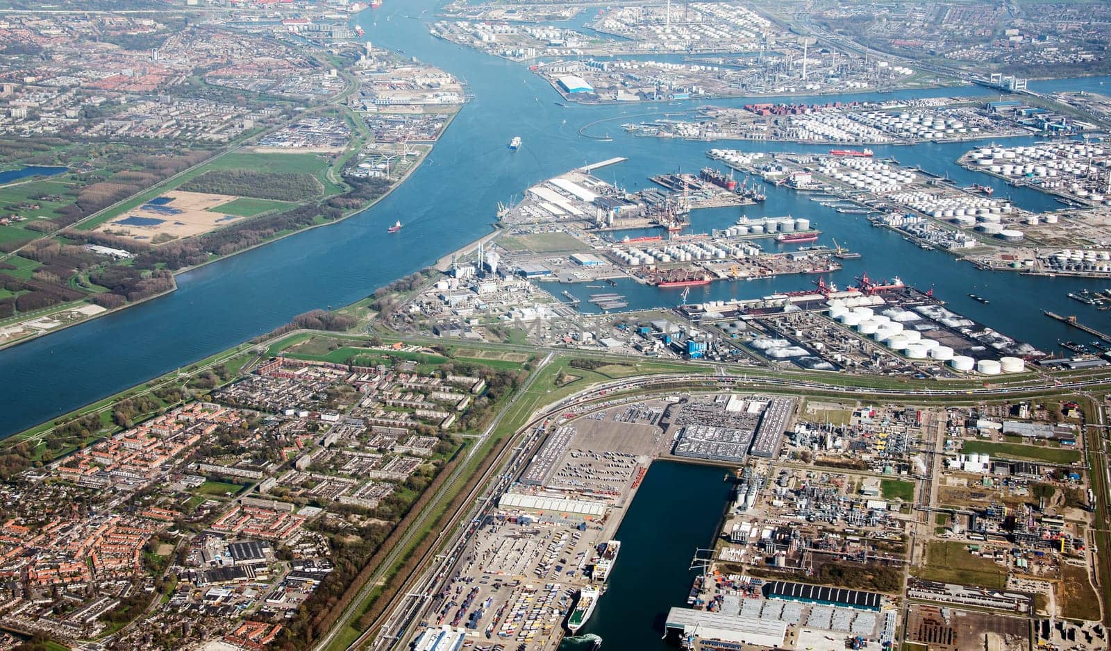 oli refinery and bridges from europoort seen from airplane with rozenburg vilage on the left