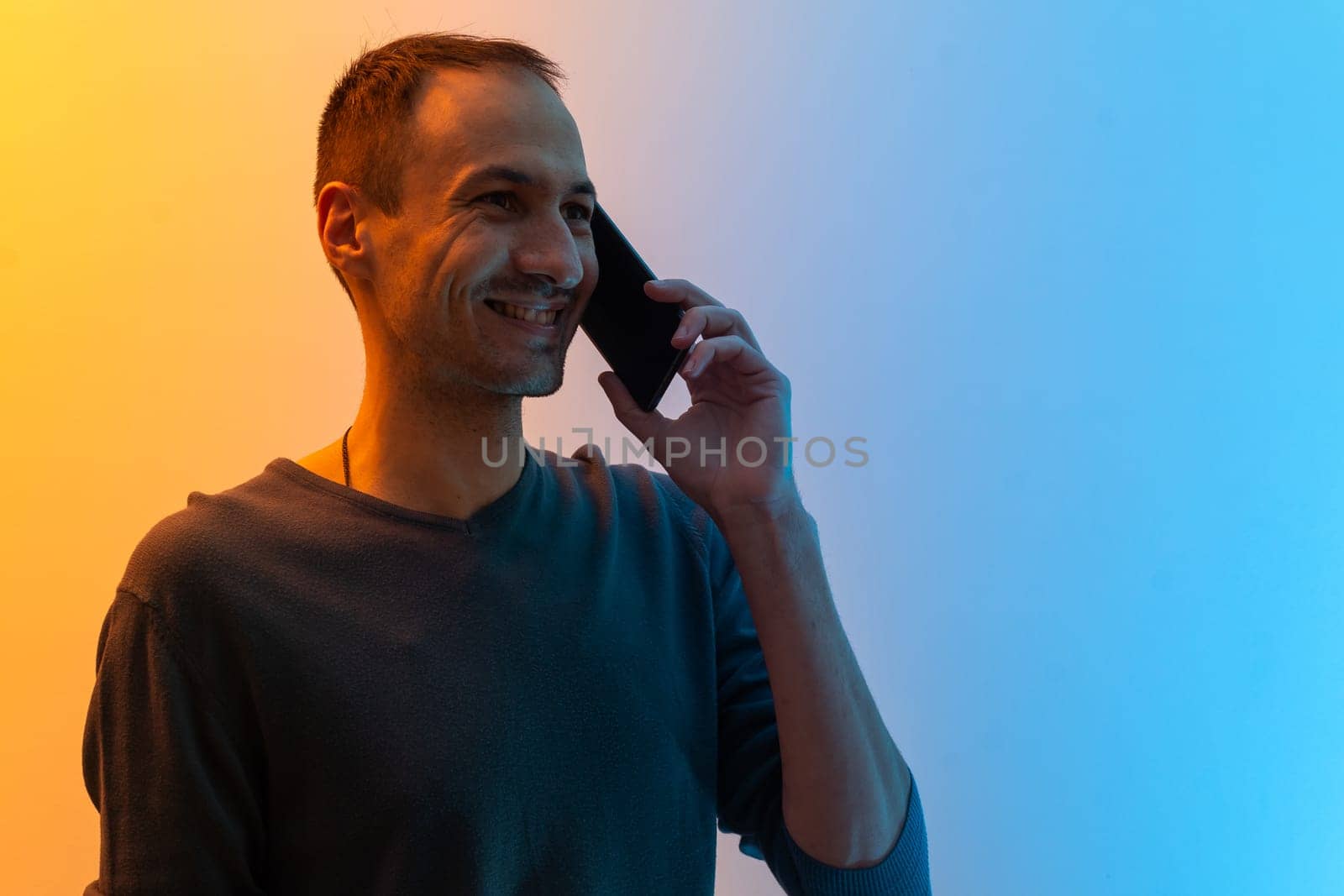 man with smartphone colored background.