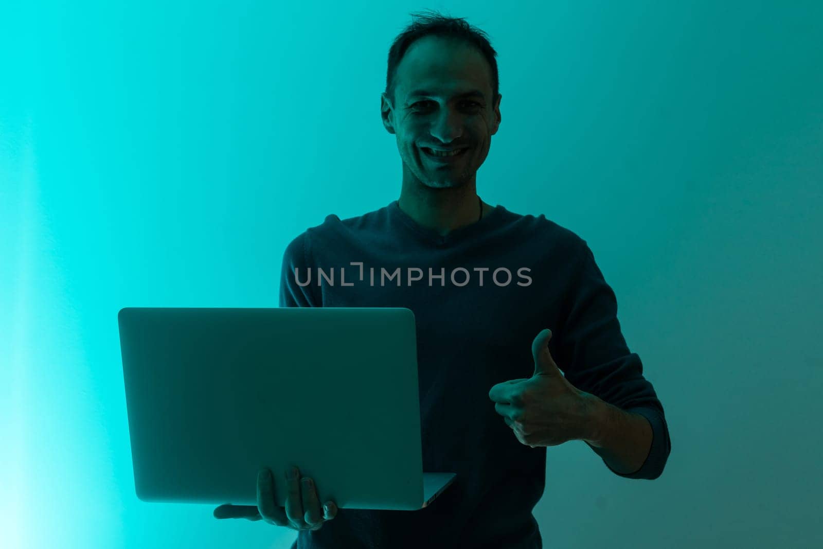 man with laptop color background.