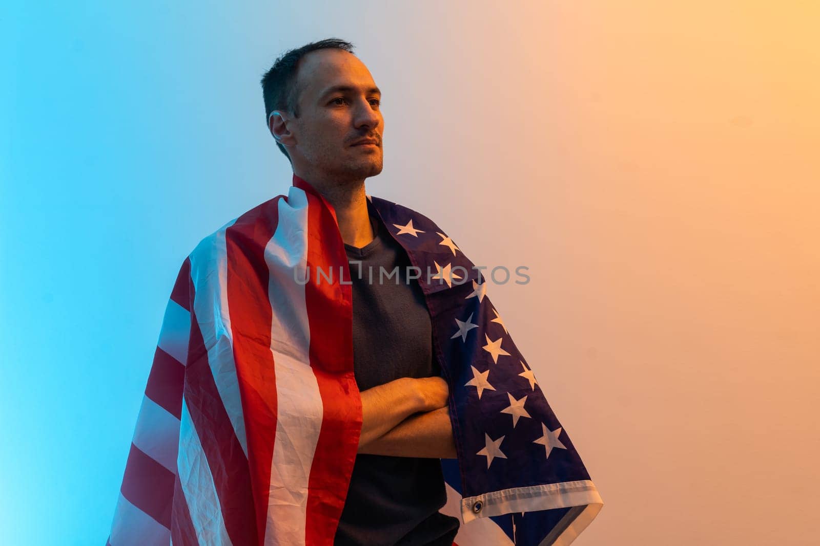 man is holding american USA flag