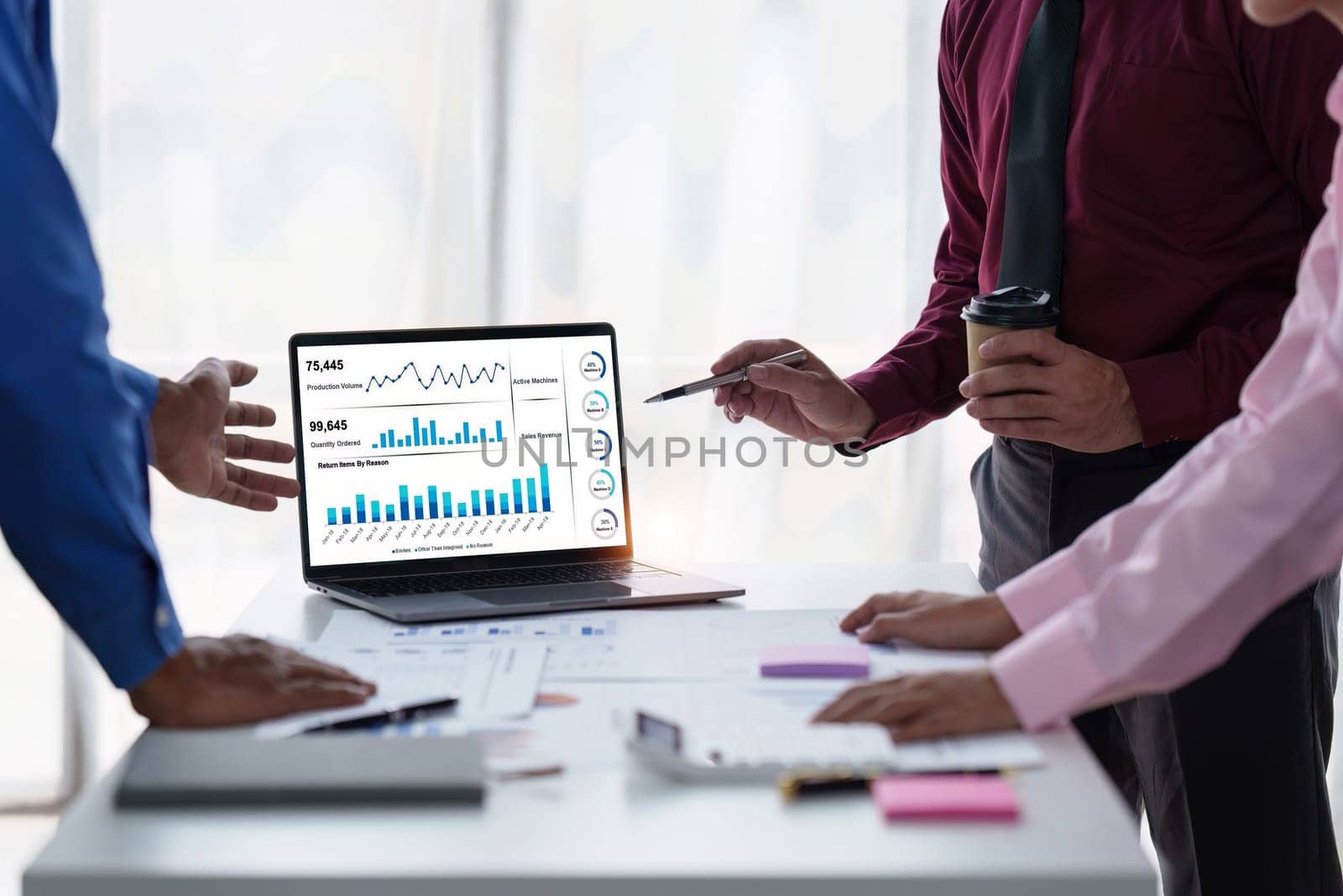 Close up of Diverse colleagues gather brainstorm discuss financial statistics at office meeting. finance, teamwork, Big data Graphs Charts concept.