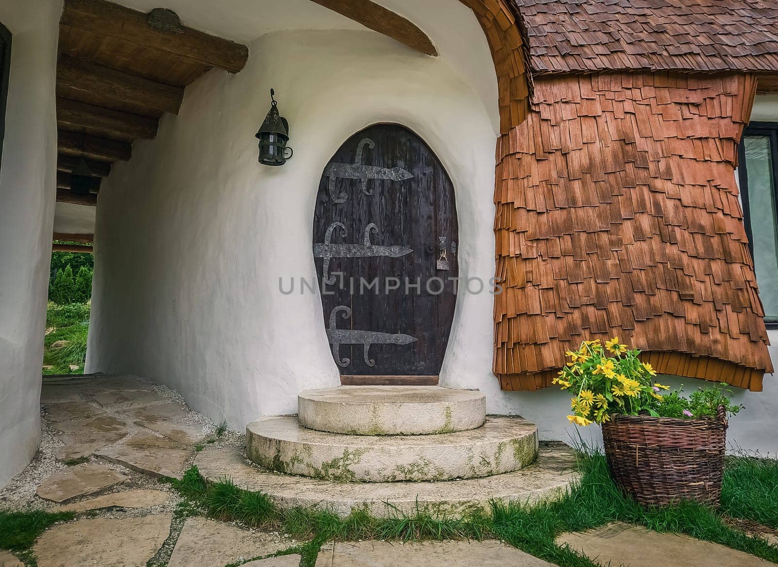 The Clay Castle from the Valley of Fairies, a touristic complex in Transylvania, Romania. Closeup view to a tiny entrance door, fantasy hobbit house from tales