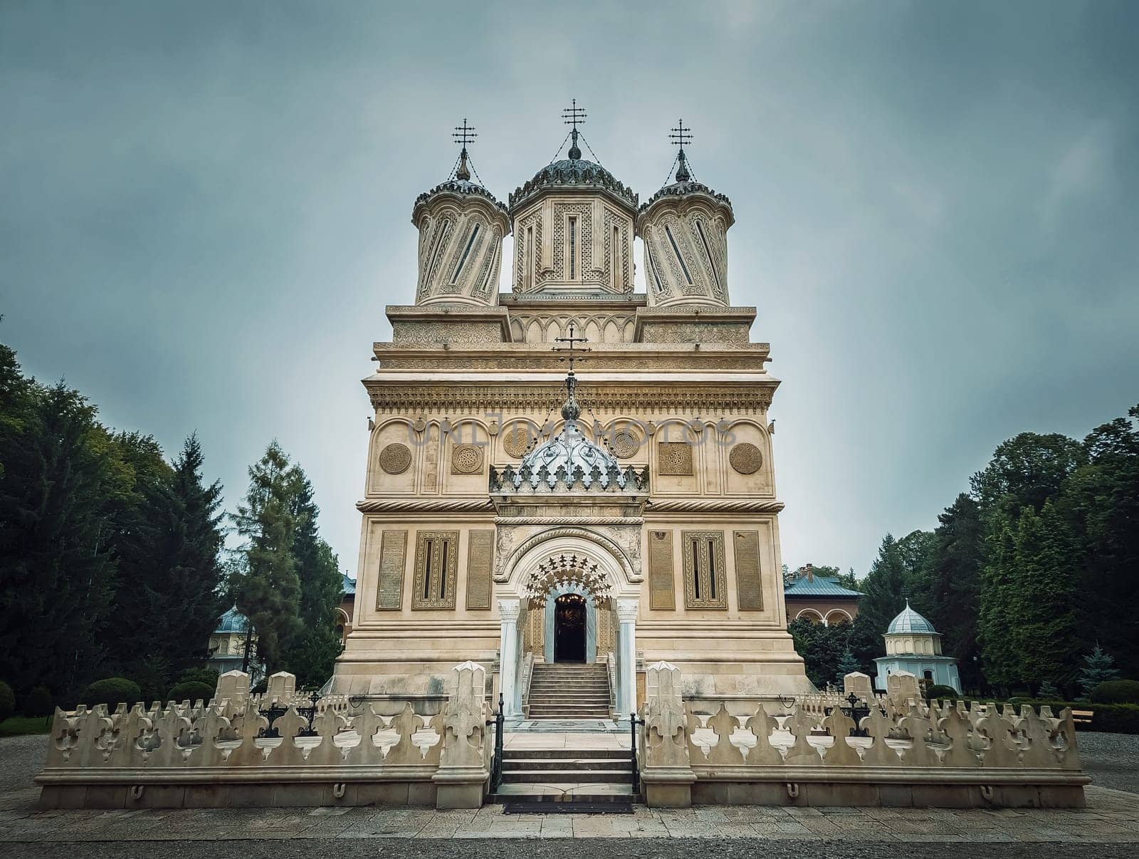 Curtea de Arges old Christian Orthodox monastery in Romania. Beautiful Cathedral facade and architectural details from the legend of Manole craftsman by psychoshadow