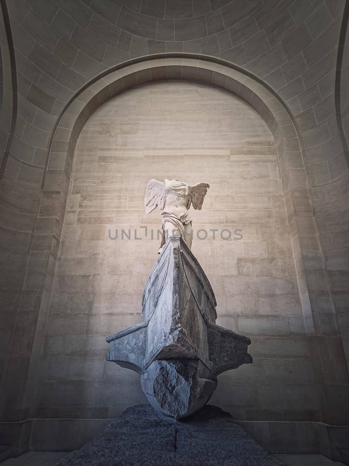 Winged Victory of Samothrace statue in the hall of Louvre museum, Paris, France by psychoshadow