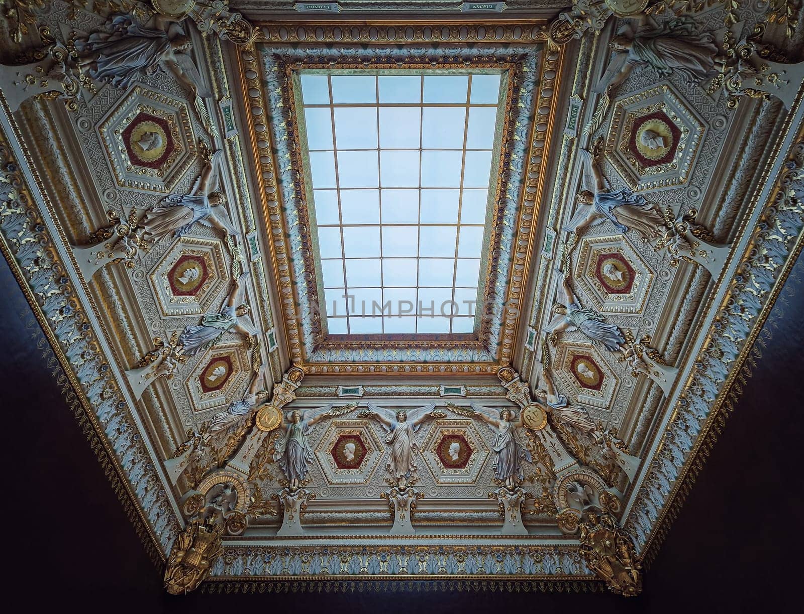 Louvre Palais ornate ceiling with glass window in center. Angels sculptures with golden decorations by psychoshadow