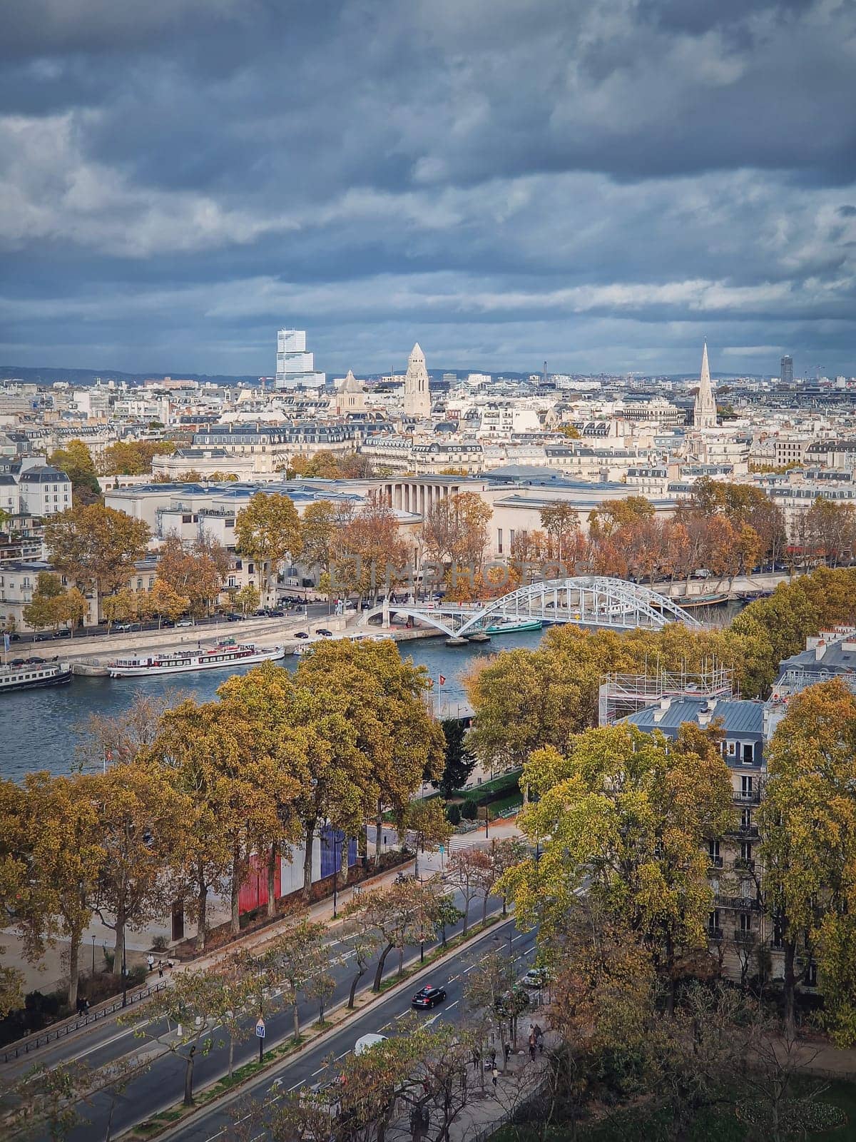 Aerial view of Paris city, France. Autumnal cityscape with colorful trees along Seine river by psychoshadow