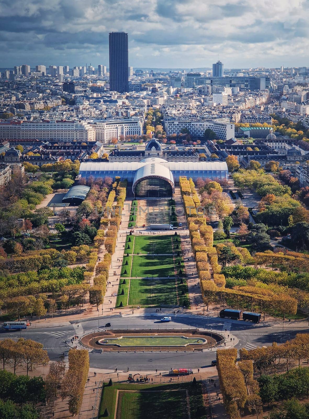 Scenery view to the Paris city from the Eiffel tower height, vertical background. Montparnasse tower and Les Invalides seen on the horizon, France by psychoshadow
