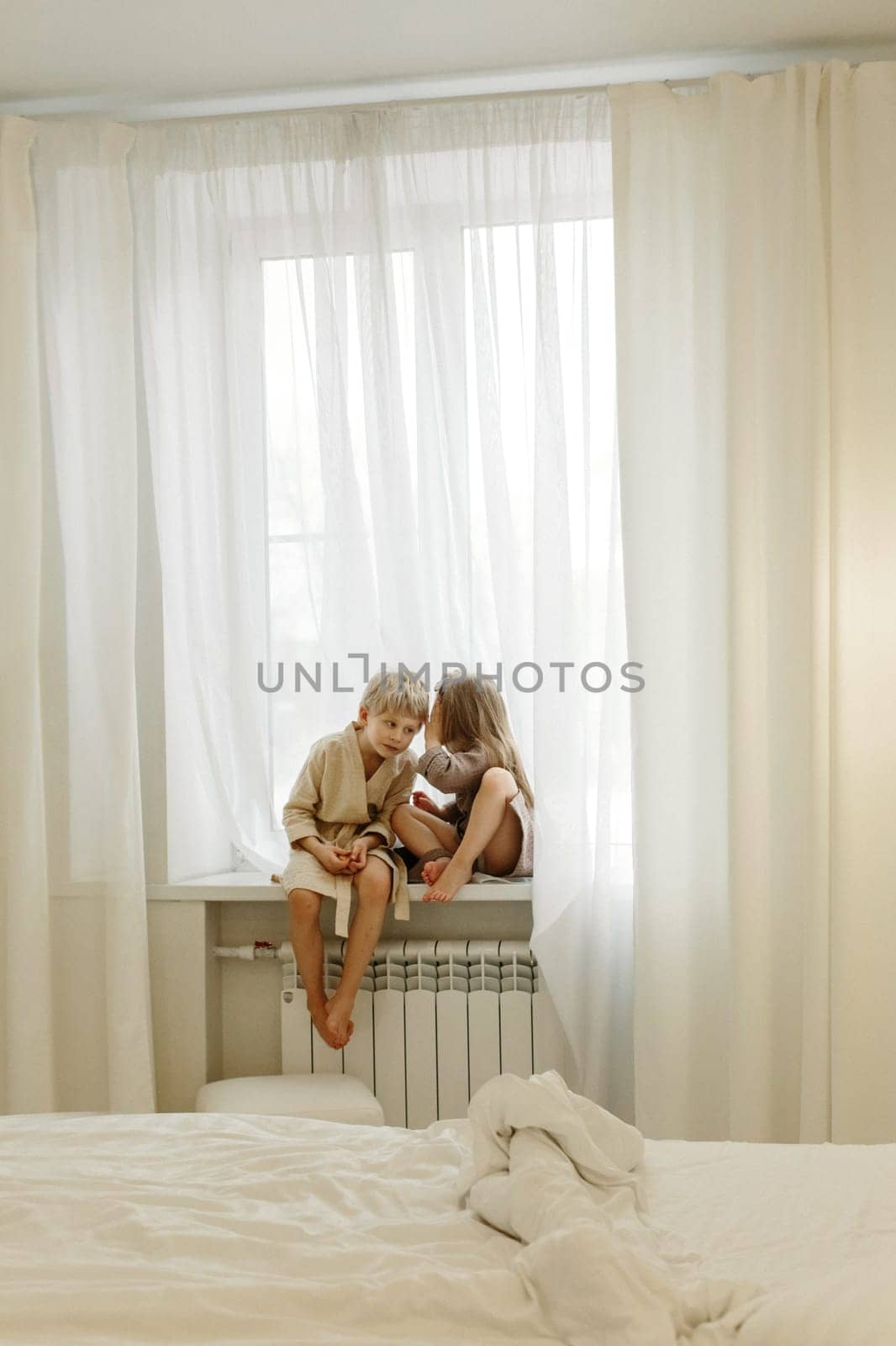 A boy and a girl in bathrobes are sitting on the windowsill, talking, playing by Sd28DimoN_1976