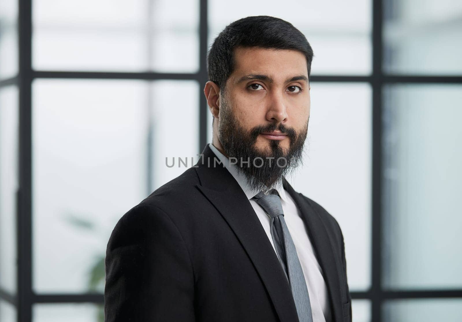 Business concept - portrait Handsome business man with a confident face.