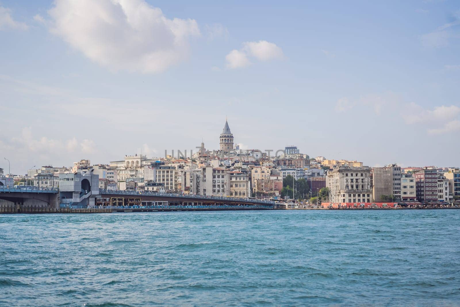 Istanbul city skyline in Turkey, Beyoglu district old houses with Galata tower on top, view from the Golden Horn.