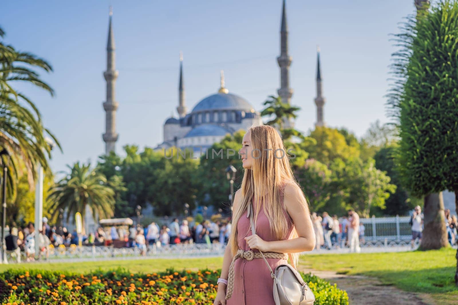 Woman tourist enjoying the view Blue Mosque Sultanahmet Camii Istanbul, Turkey.