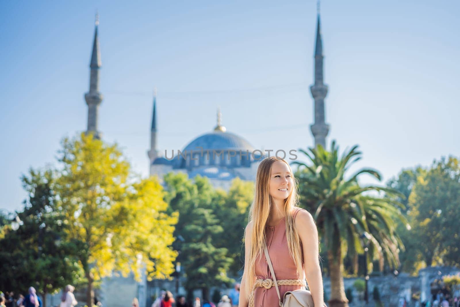 Woman tourist enjoying the view Blue Mosque Sultanahmet Camii Istanbul, Turkey.