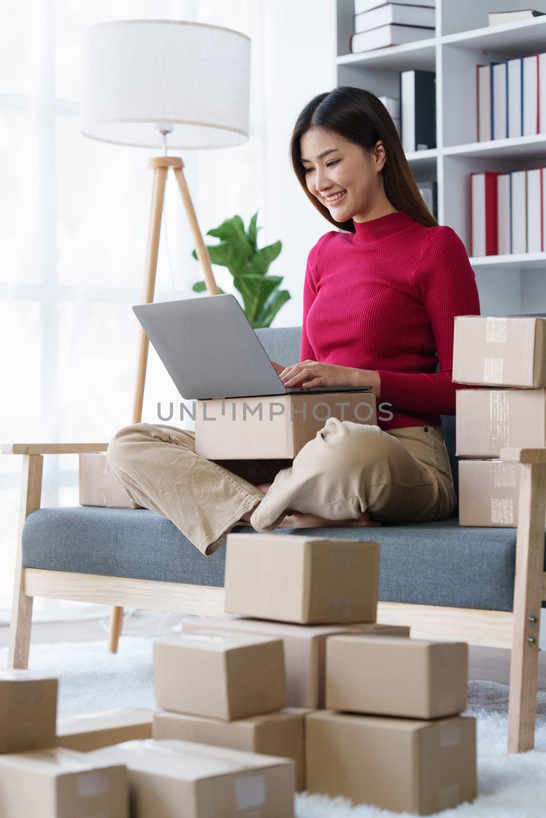 Small businesses SME owners female entrepreneurs check online orders to prepare to pack the boxes, sell to customers, sme business ideas online.