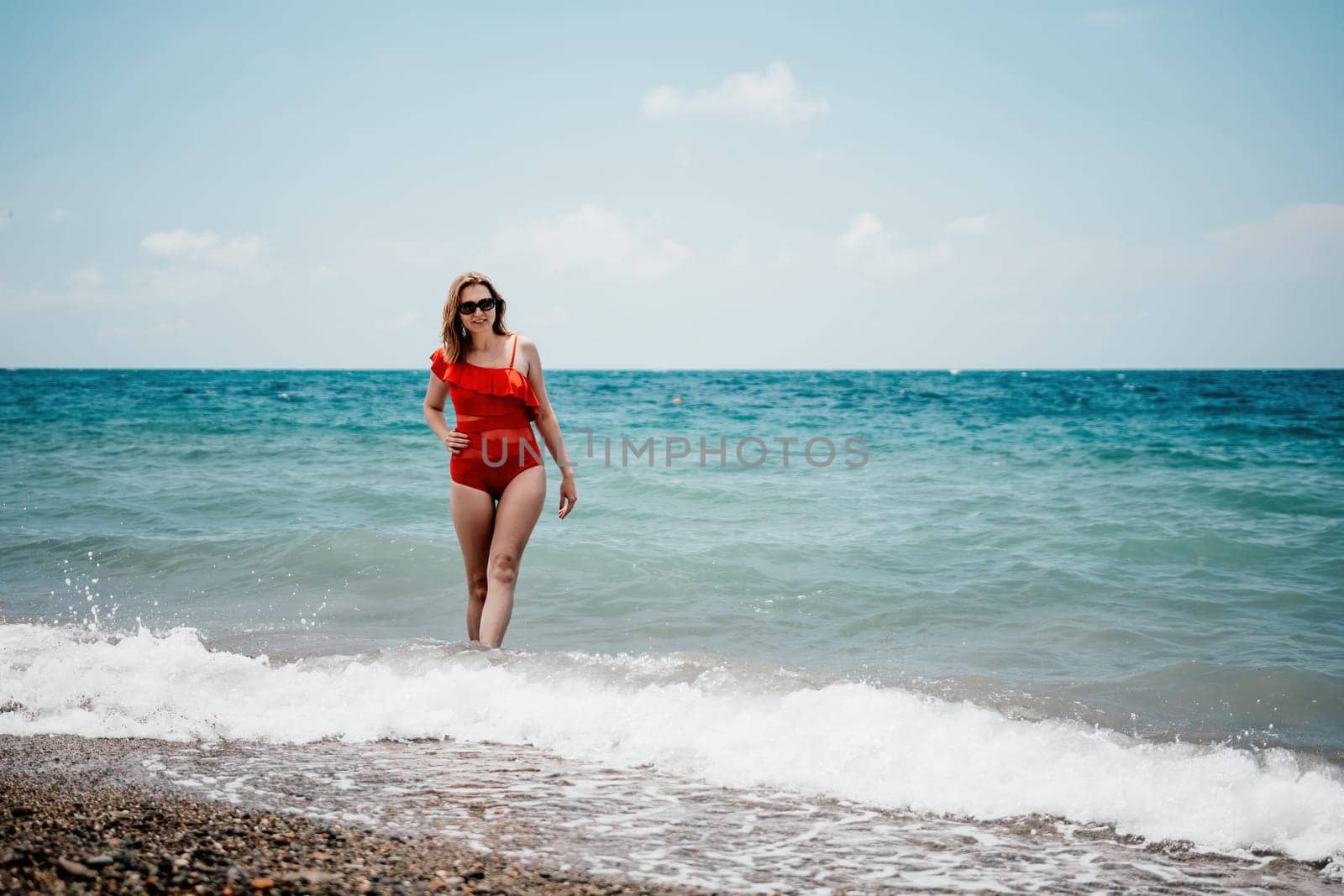 Happy loving family mother and daughter having fun together on the beach. Mum playing with her kid in holiday vacation next to the ocean - Family lifestyle and love concept by panophotograph