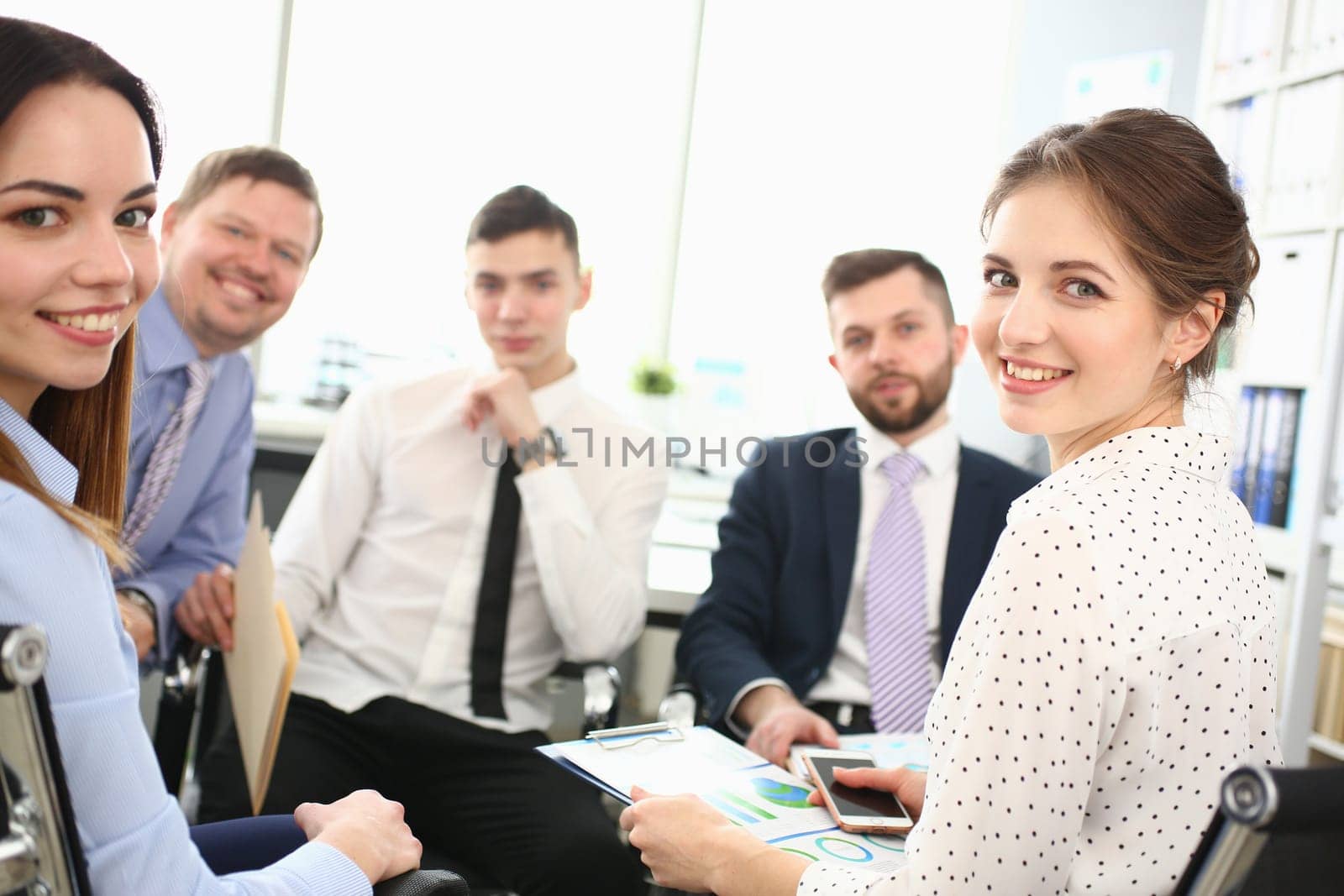 Corporate business team and managers at meeting in office by kuprevich