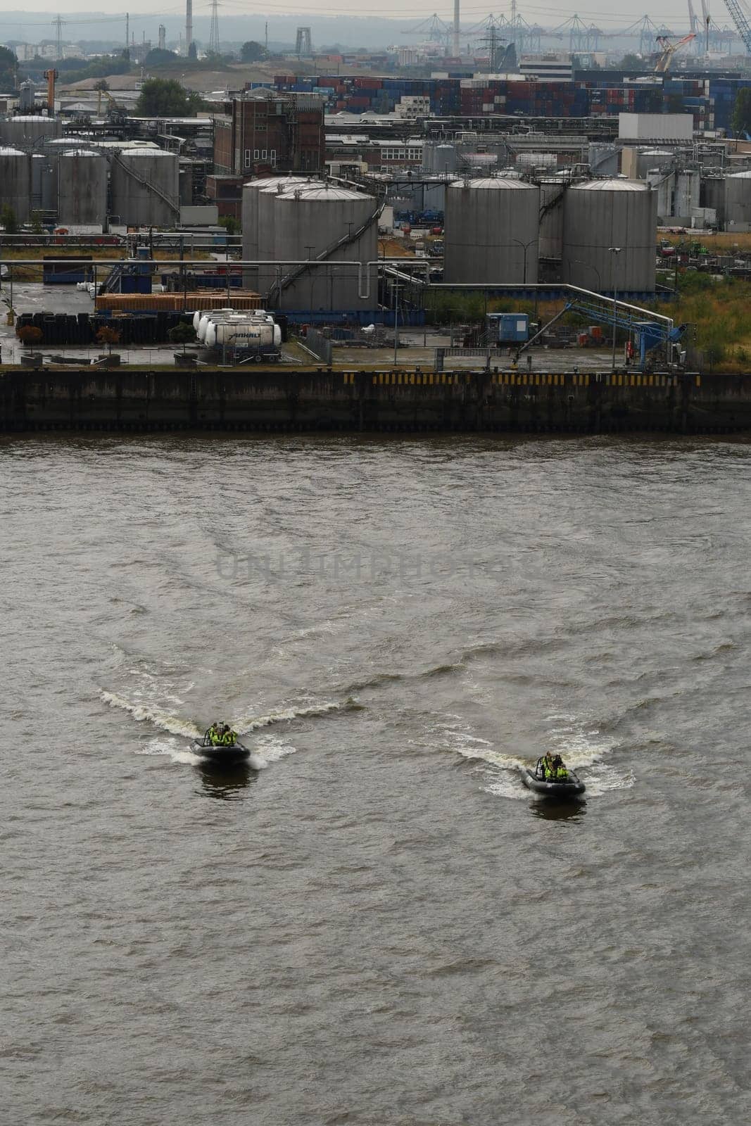 Black inflatable speed boats on the Elbe in Hamburg