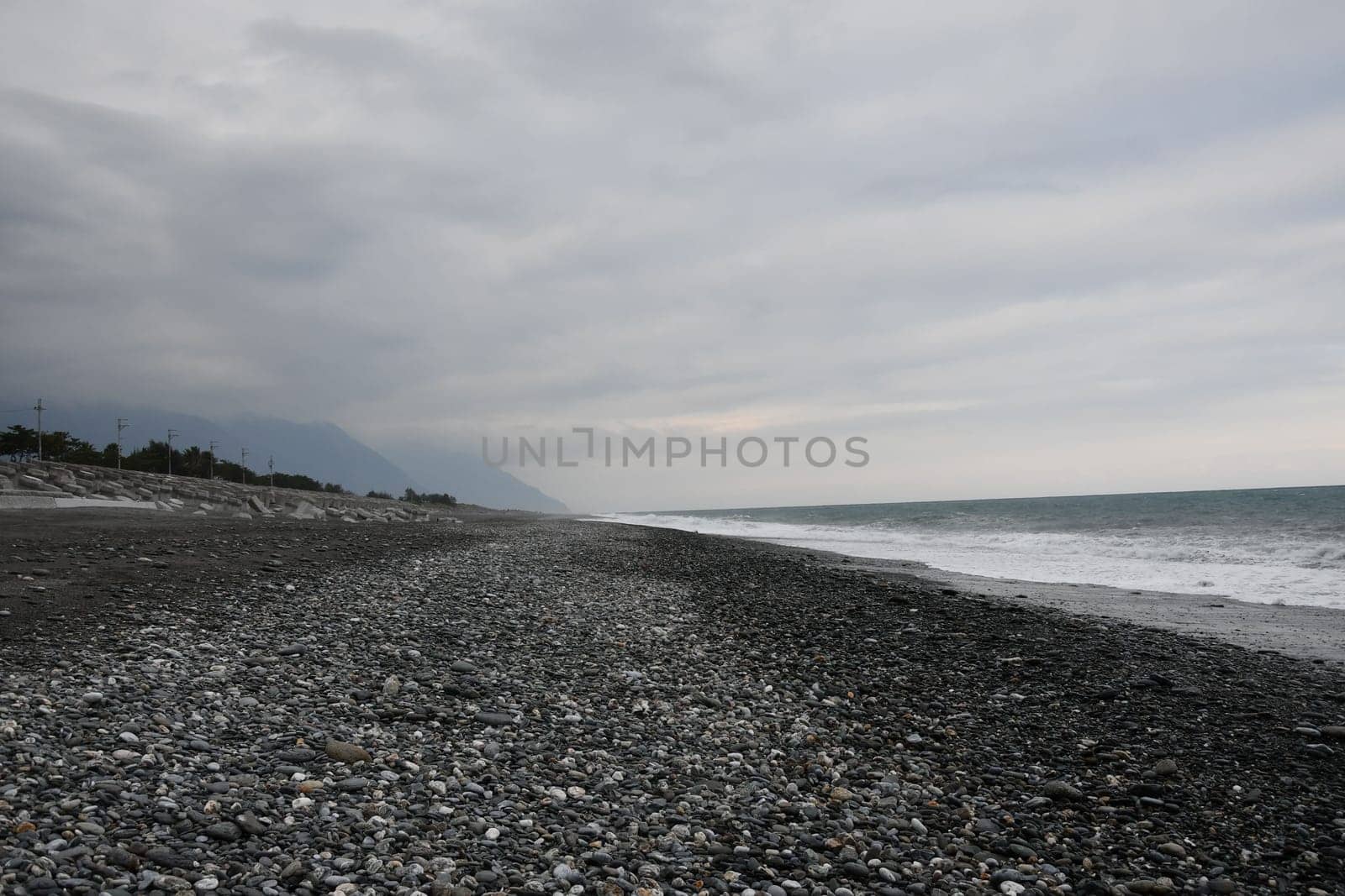 Black and rocky beach at the coast in Xincheng Township, Taiwan