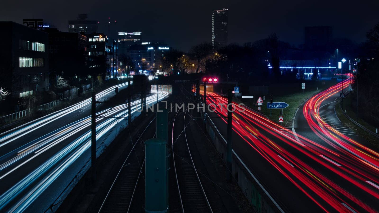 Long exposure - light traces of cars on the A40 freeway in Essen, Germany. German Autobahn at night