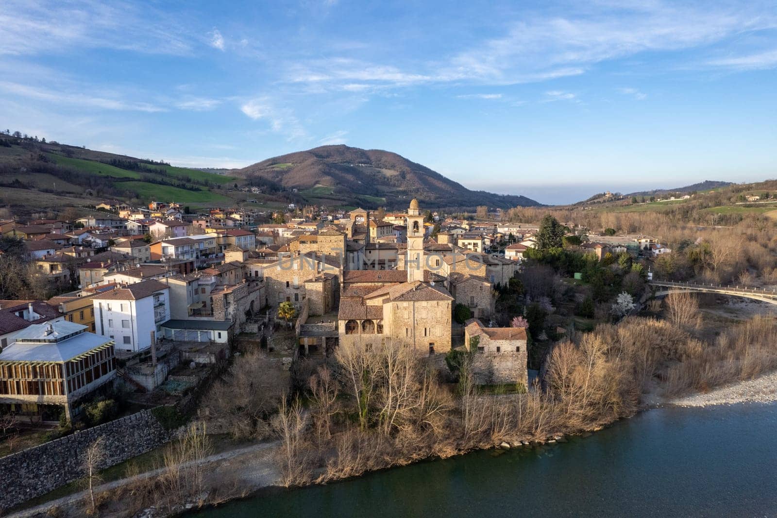 Aerial scenic view of Travo Village, Trebbia river, Valley landscape, Piacenza Italy at sunset