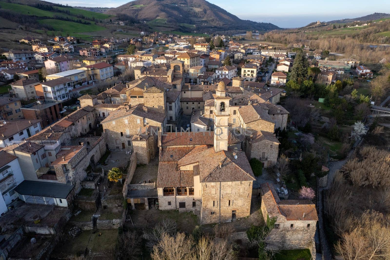 Aerial scenic view of Travo Village, Trebbia river, Valley landscape, Piacenza Italy at sunset
