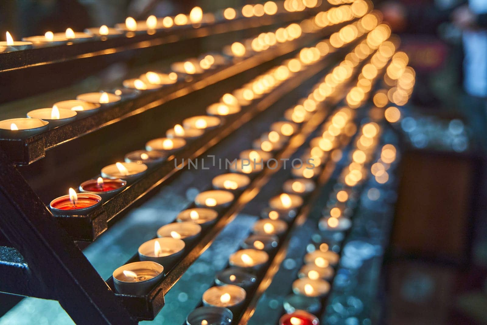 Many candles burn in a temple in Vienna. High quality 4k footage.