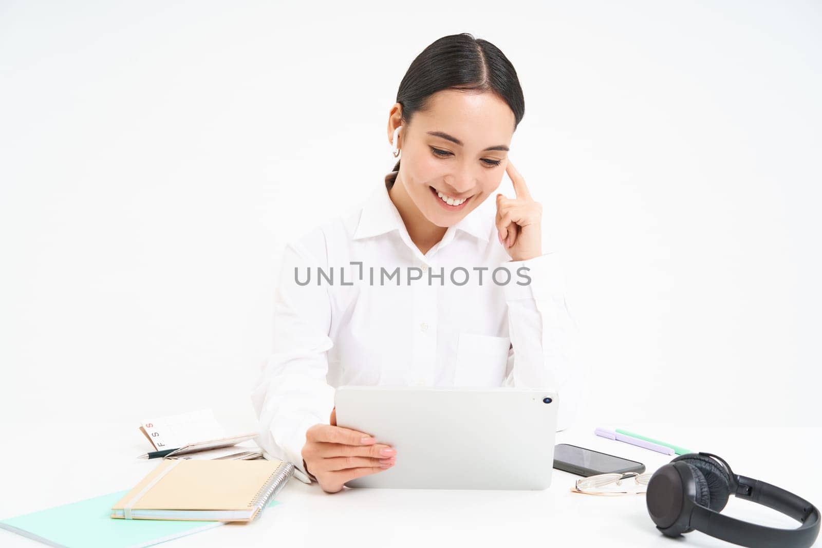 Image of saleswoman, asian entrepreneur talks on video chat from her office, has a meeting, connects to webinar online, white background.