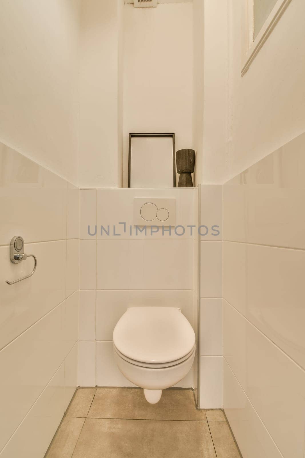 a white toilet in a bathroom with tile flooring and wall mounted mirror above the toilet bowl on the right side