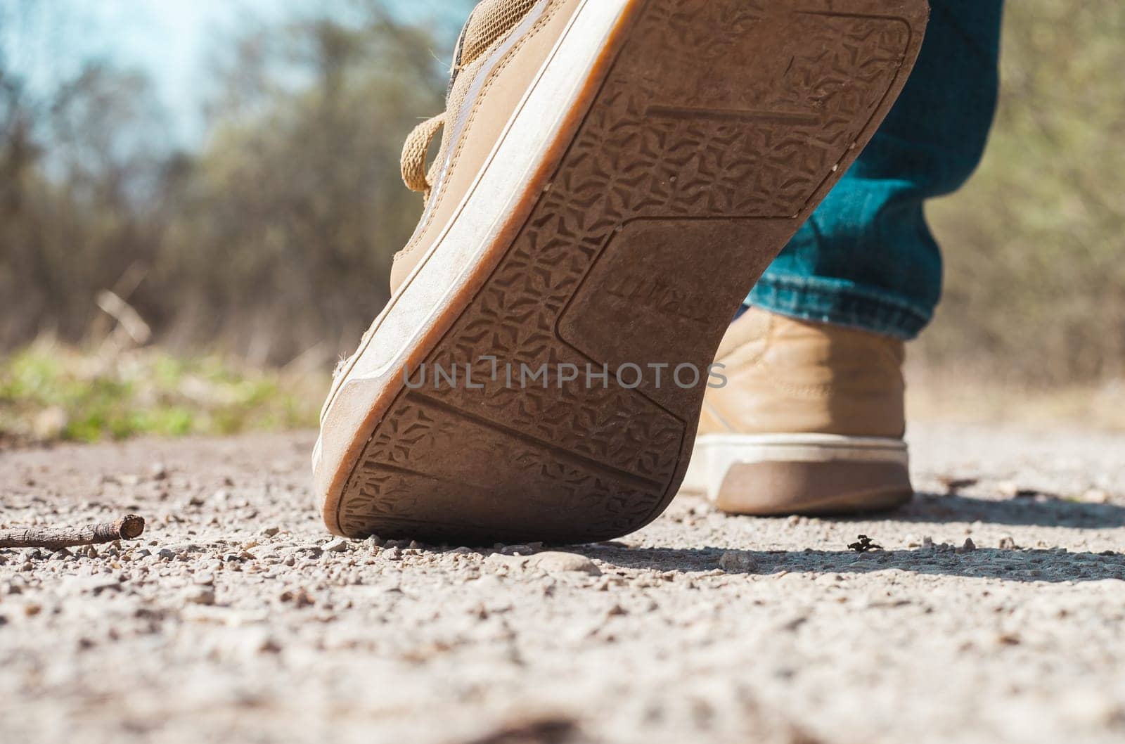 Lifestyle walk on road in forest sneakers man