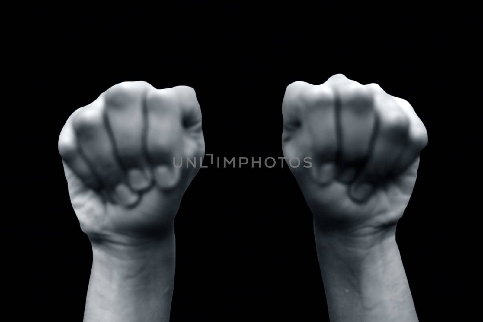 Mushti Yoga Mudra is demonstrated by a single male hand isolated against a black background.