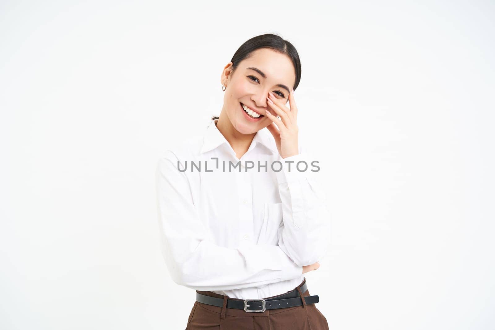Wellbeing and workplace. Smiling happy asian saleswoman, office manager laughing and looking joyful, isolated over white background by Benzoix
