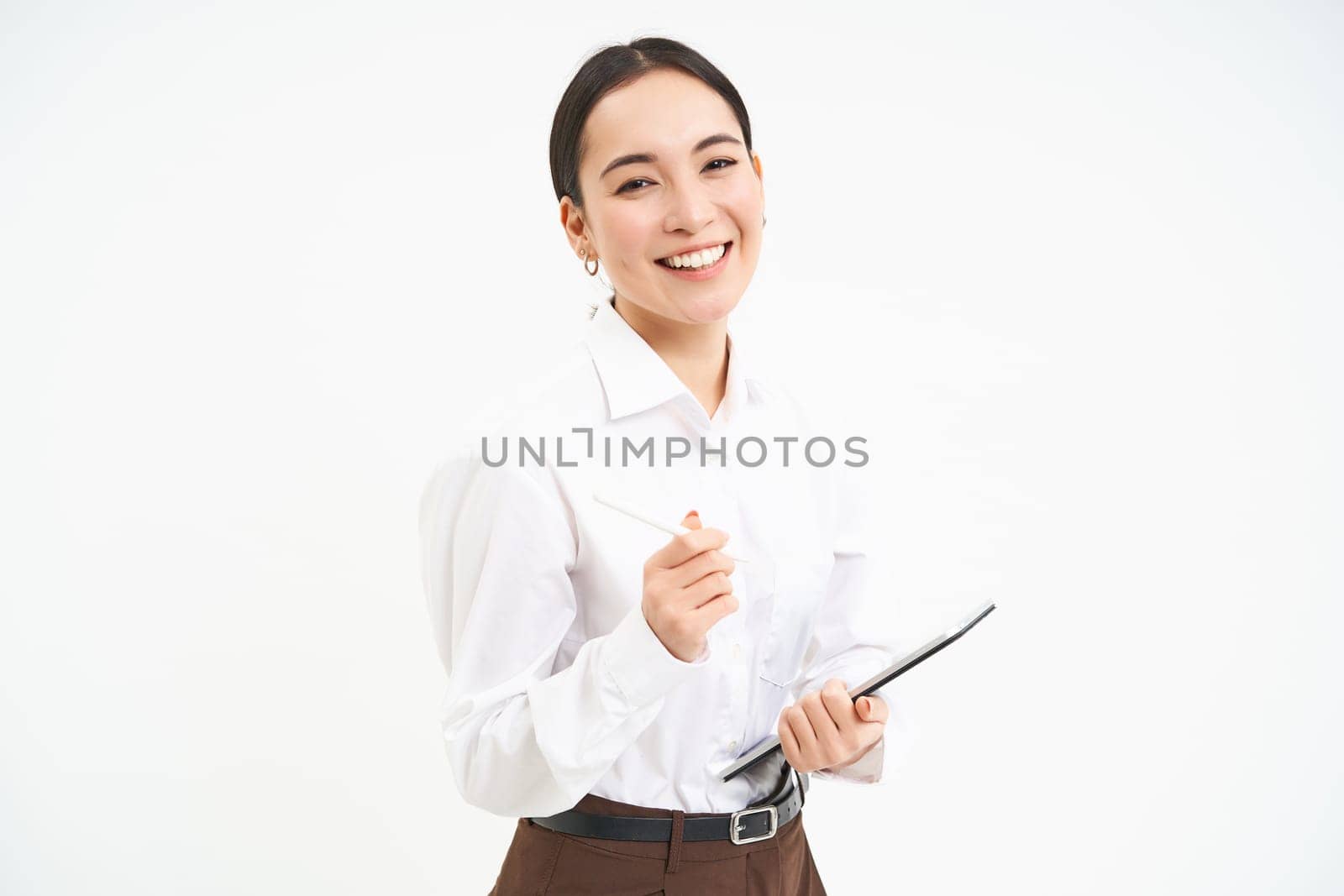 Beautiful asian woman, entrepreneur with digital tablet, working on business project, leading meeting and looking at notes on device, white background.