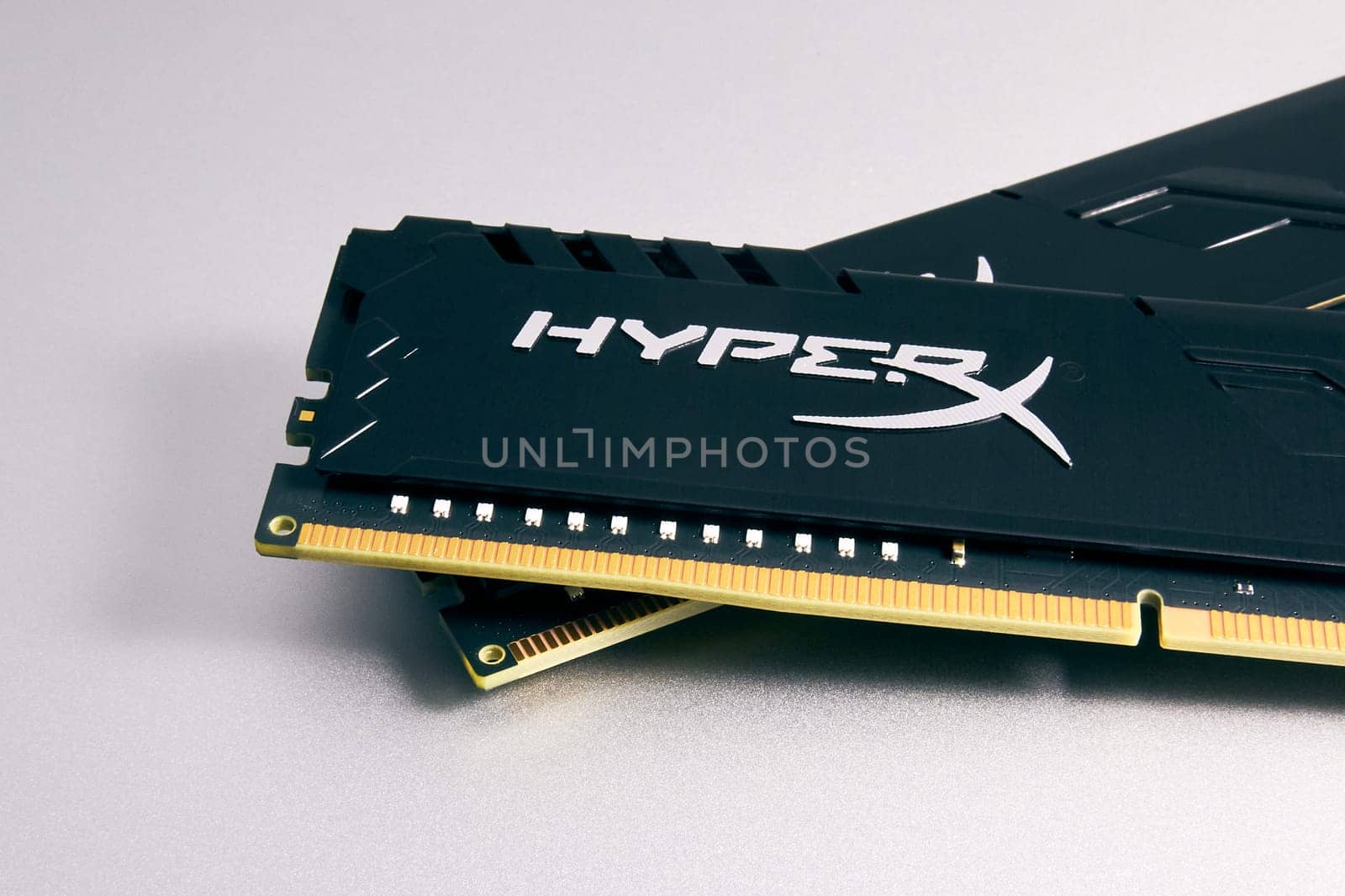 Ryazan, Russia - February 5, 2023: HyperX DDR4 RAM modules on a silver surface close-up. Parts for building and upgrading a PC