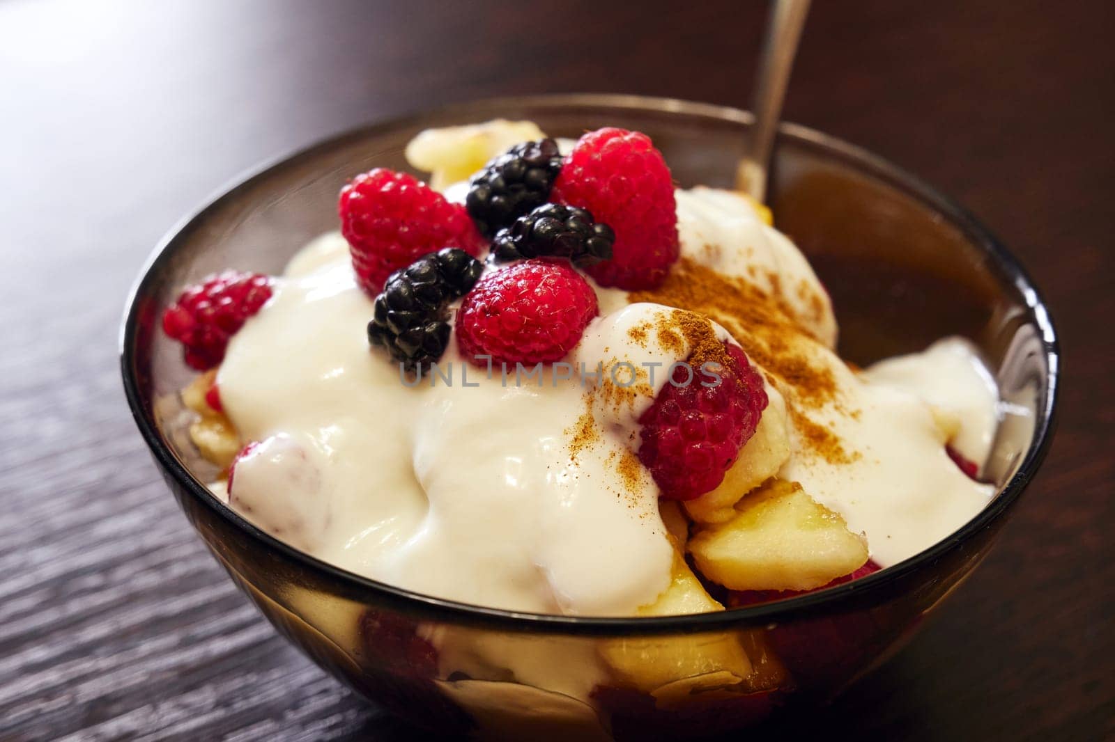 Fresh delicious fruit salad on the table close up