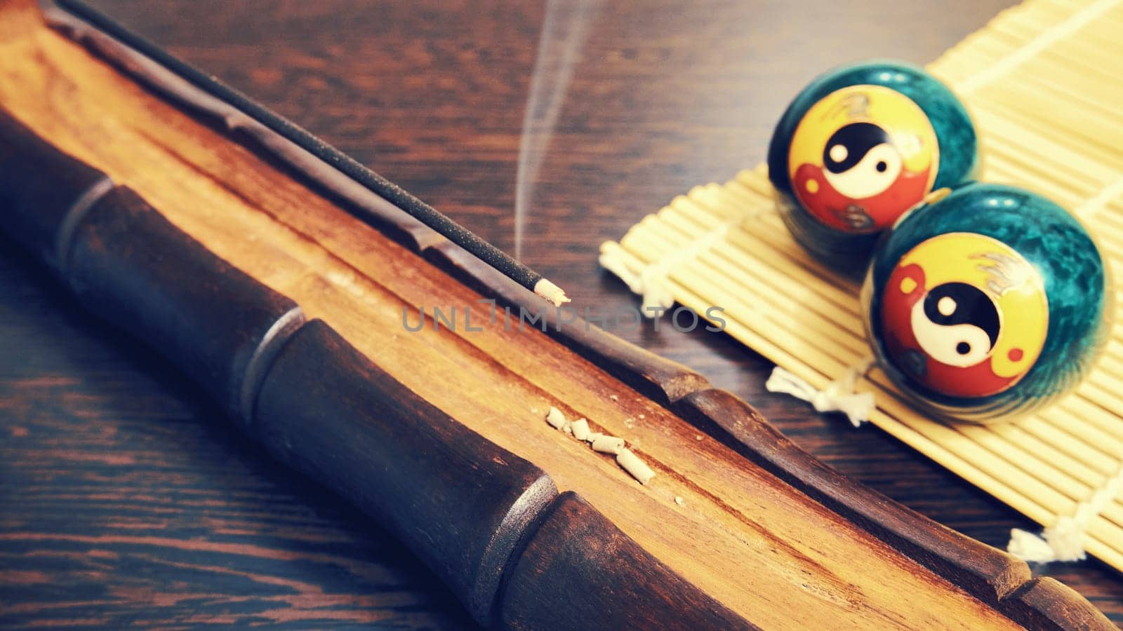 Smoky incense stick. Aroma stick with holder on wooden table