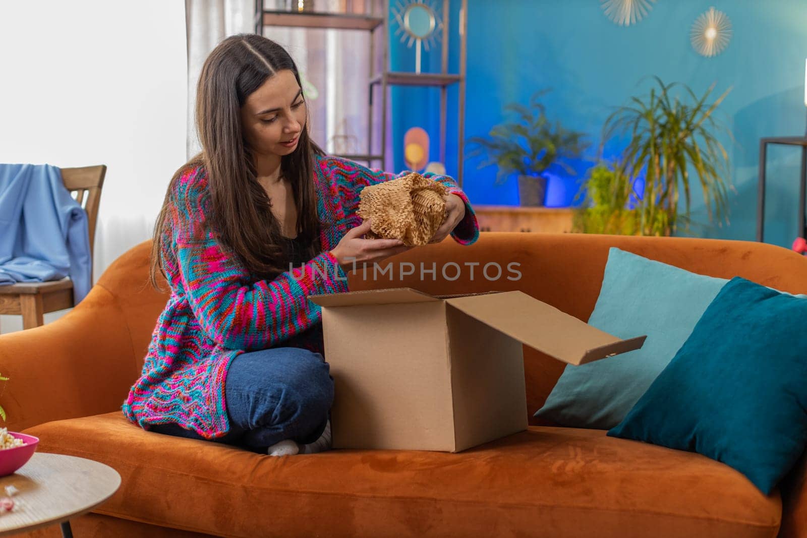 Happy woman packing delivery parcel product order. Portrait of Caucasian girl shop seller closing cardboard box sending purchase gift by fast postal shipping, online market delivery freelance at home