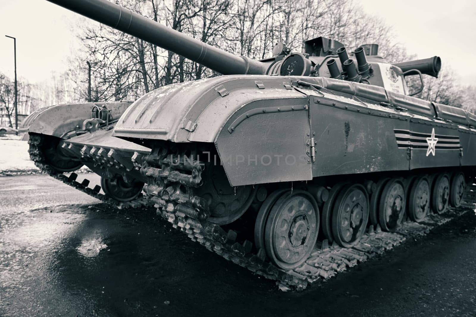 Tank on a city street. Tank tracks close-up