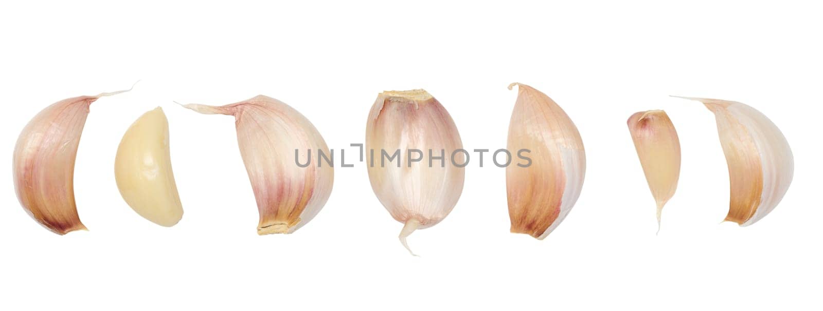 Peeled and unpeeled garlic on a white isolated background by ndanko