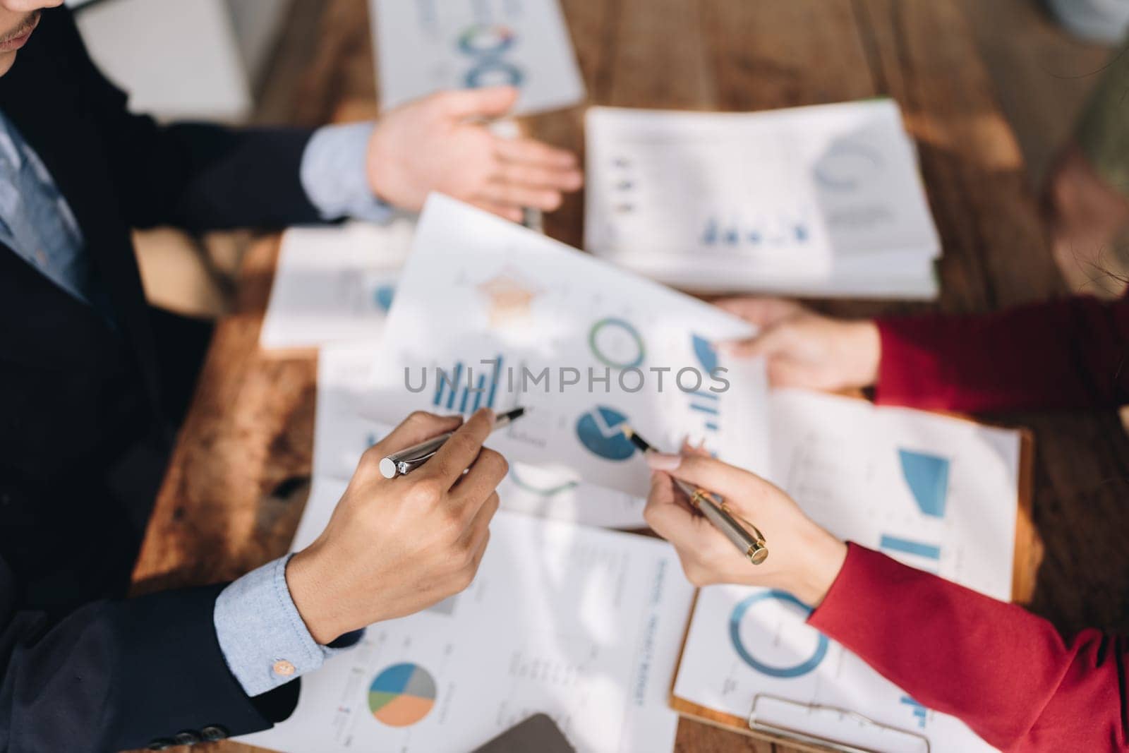 startup business, business advisor leadership for planning finance investment teamwork paperwork audit and discussing marketing, profit, budget of company in meeting room. by Manastrong