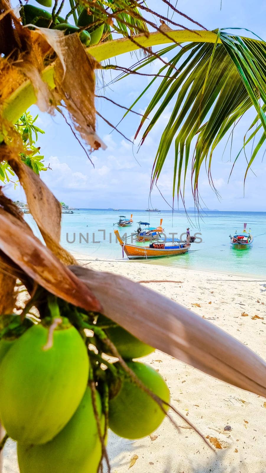 Longtail boats in the blue ocean of Koh Lipe Island Southern Thailand