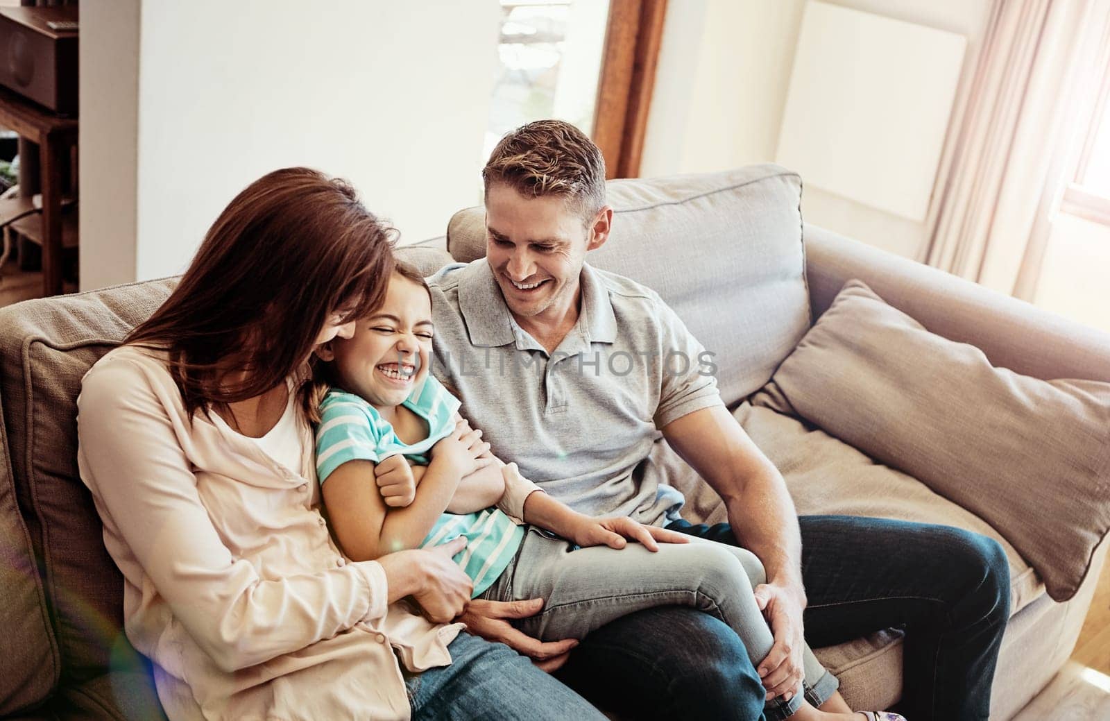 Family time is the happiest of times. a family bonding together at home. by YuriArcurs