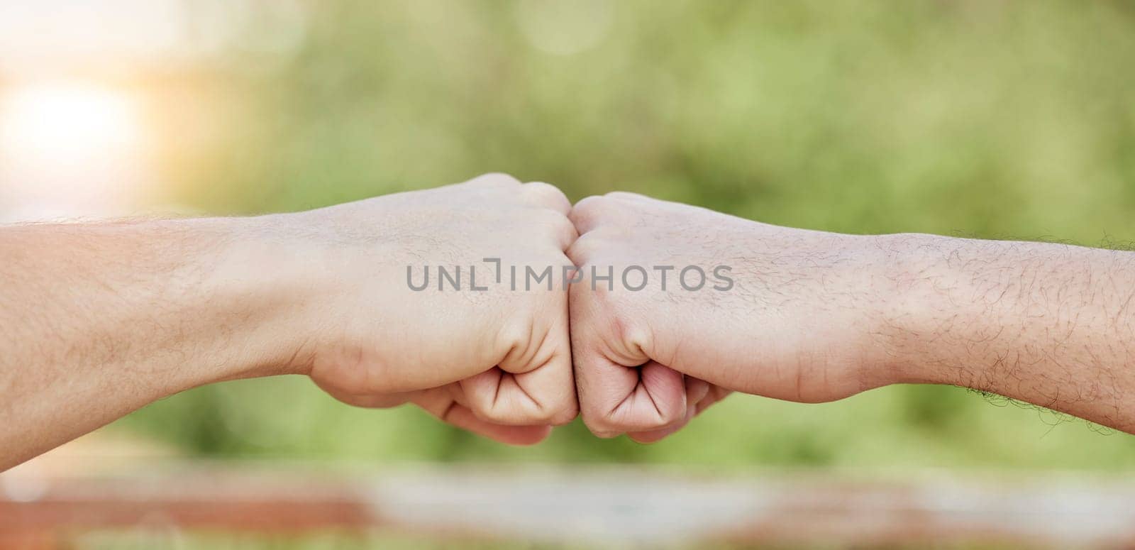 Closeup of people, hands and fist bump for success, teamwork and greeting outdoors. Friends, community and bumping hand for collaboration, motivation and trust of solidarity, support and cooperation by YuriArcurs