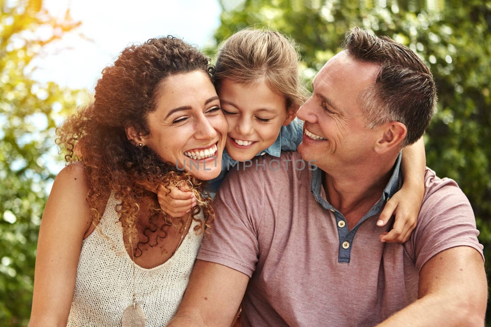 Love is what makes a family. a family of three enjoying a day outdoors